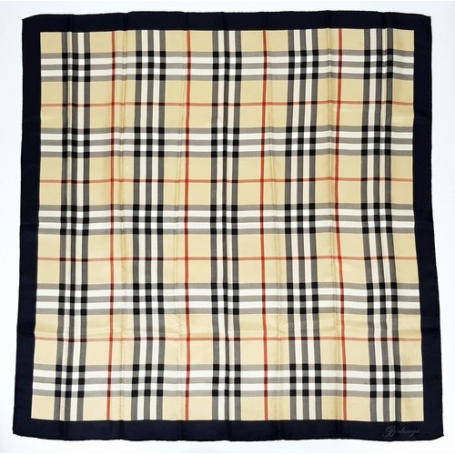 1178 - A Burberry Vintage Check Silk Scarf. Crafted from soft silk in a beige, black, and red vintage check... 