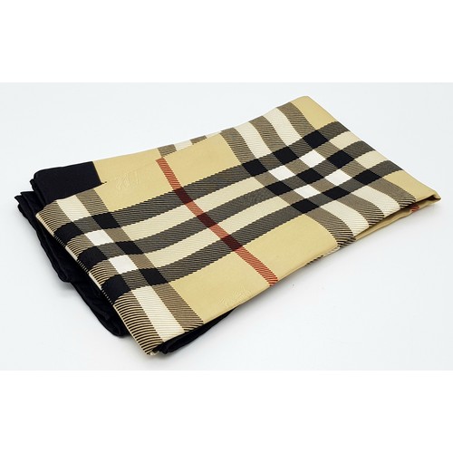 1178 - A Burberry Vintage Check Silk Scarf. Crafted from soft silk in a beige, black, and red vintage check... 