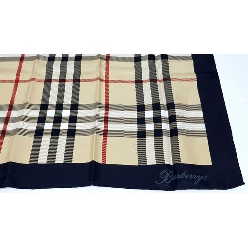 1178 - A Burberry Vintage Check Silk Scarf. Crafted from soft silk in a beige, black, and red vintage check... 