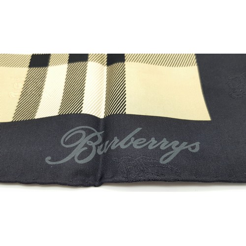 1178 - A Burberry Vintage Check Silk Scarf. Crafted from soft silk in a beige, black, and red vintage check... 