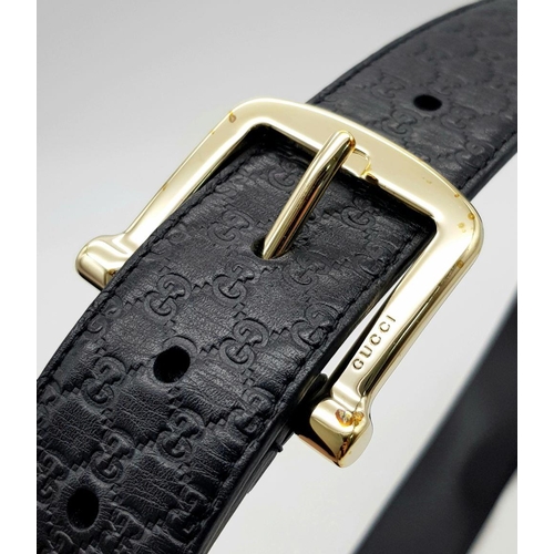 718 - A Gucci Soft Microguccissima Margaux Calfskin Belt. Black leather with GG monogram embossed design a... 