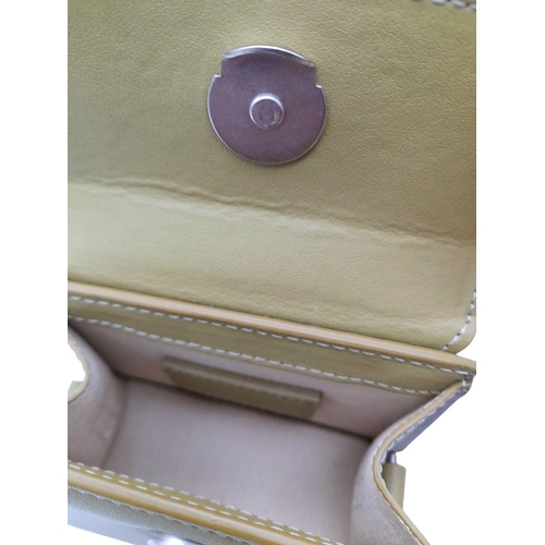 725 - A Jacquemus Le Chiquito Olive Green Mini Bag. Olive green leather exterior with silver-toned hardwar... 