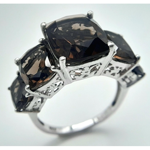 1020 - A Five Stone Set Smoky Quartz Sterling Silver Ring Size P. The Ring is set with graduating size, Hig... 