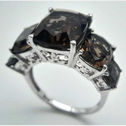 1020 - A Five Stone Set Smoky Quartz Sterling Silver Ring Size P. The Ring is set with graduating size, Hig... 