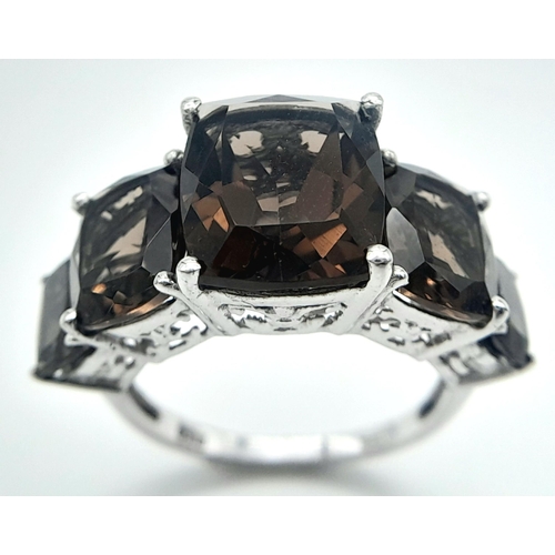 1020 - A Five Stone Set Smoky Quartz Sterling Silver Ring Size P. The Ring is set with graduating size, Hig... 