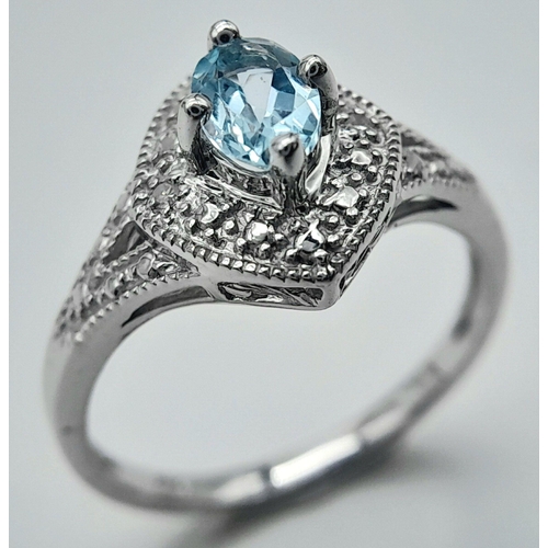 1103 - A Blue Topaz Set Sterling Silver Ring Size L. The Ring Measures 1.2cm Wide at the crown and weighs 2... 