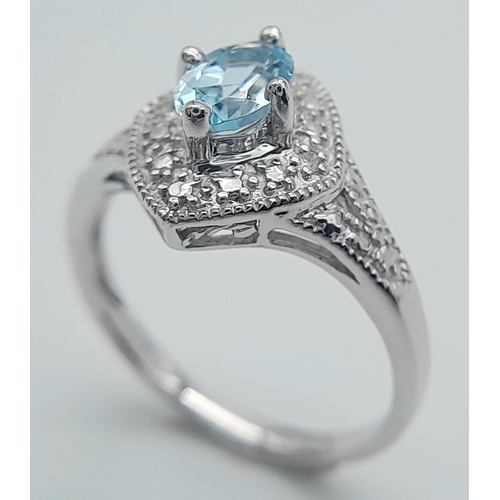 1103 - A Blue Topaz Set Sterling Silver Ring Size L. The Ring Measures 1.2cm Wide at the crown and weighs 2... 