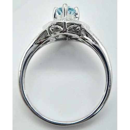 1103 - A Blue Topaz Set Sterling Silver Ring Size L. The Ring Measures 1.2cm Wide at the crown and weighs 2... 