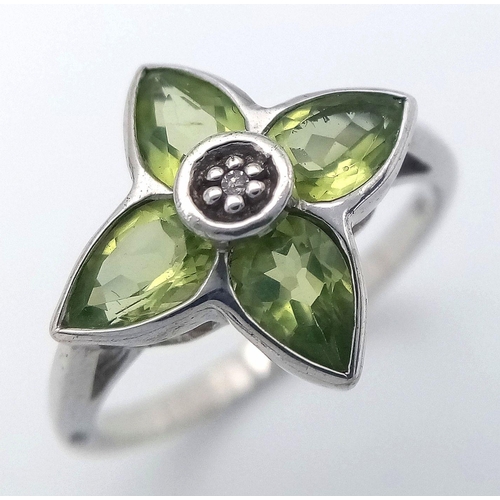 1117 - A Sterling Silver Peridot and Diamond Set Ring Size O. The Crown Measures 1.5cm Wide and the Ring We... 