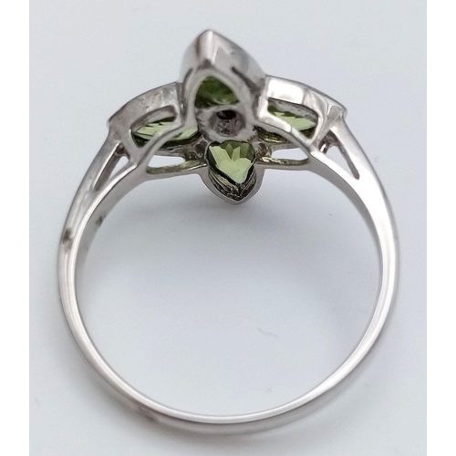 1117 - A Sterling Silver Peridot and Diamond Set Ring Size O. The Crown Measures 1.5cm Wide and the Ring We... 