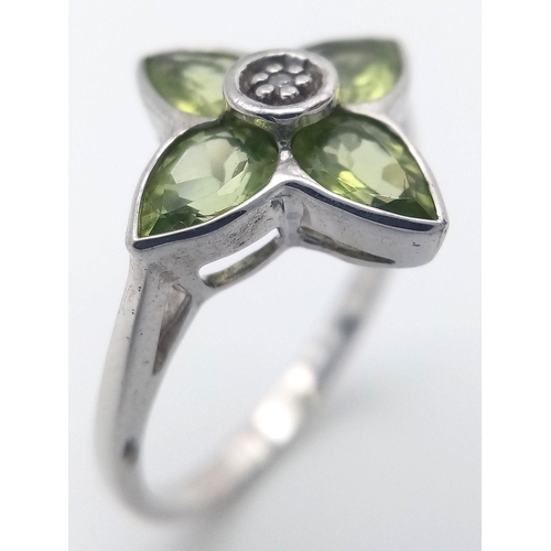 1117 - A Sterling Silver Peridot and Diamond Set Ring Size O. The Crown Measures 1.5cm Wide and the Ring We... 