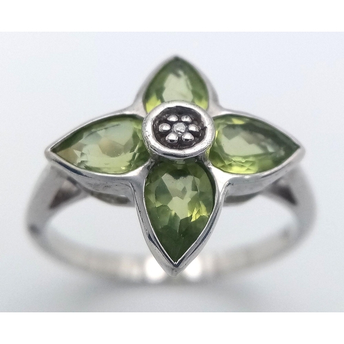 1117 - A Sterling Silver Peridot and Diamond Set Ring Size O. The Crown Measures 1.5cm Wide and the Ring We... 