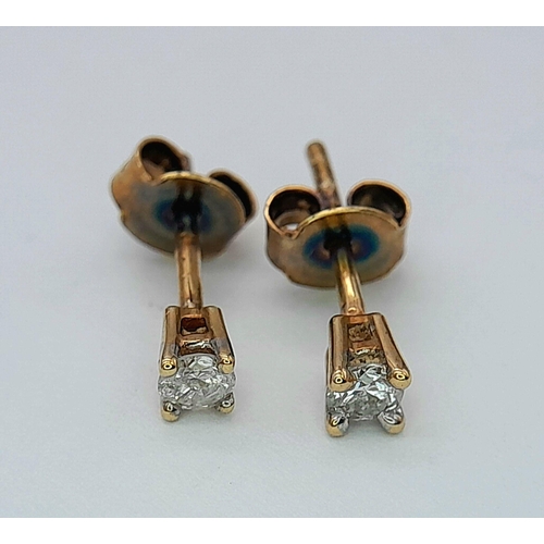 773 - A PAIR OF 9K YELLOW GOLD DIAMOND STUD EARRINGS. 0.7G TOTAL WEIGHT. APPROX. 1.4CM IN LENGTH. Ref: SC ... 