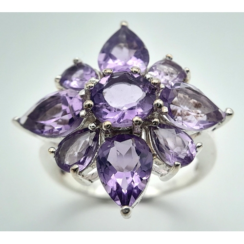 915 - A Vintage Sterling Silver Amethyst Set Cluster Ring Size P. The Ring measures 2.5 x 2.5cm at the Cro... 