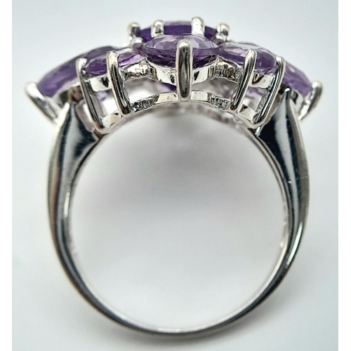 915 - A Vintage Sterling Silver Amethyst Set Cluster Ring Size P. The Ring measures 2.5 x 2.5cm at the Cro... 