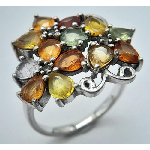 950 - A Sterling Silver Multi-Semi Precious Gemstone Set Ring Size Q. The Ring Measures 2.2cm wide at the ... 