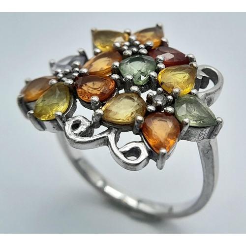 950 - A Sterling Silver Multi-Semi Precious Gemstone Set Ring Size Q. The Ring Measures 2.2cm wide at the ... 