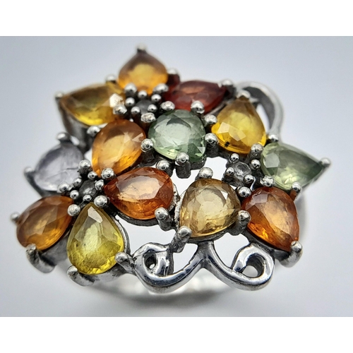 950 - A Sterling Silver Multi-Semi Precious Gemstone Set Ring Size Q. The Ring Measures 2.2cm wide at the ... 