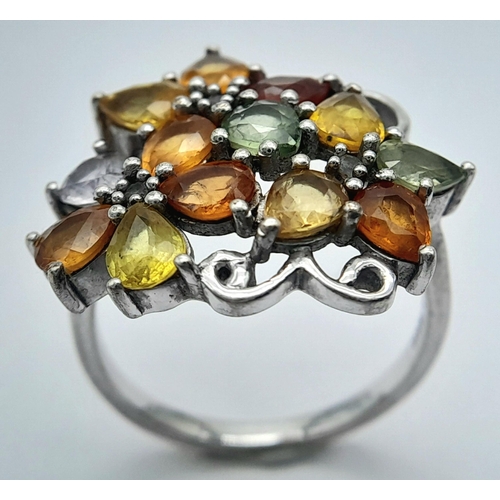 950 - A Sterling Silver Multi-Semi Precious Gemstone Set Ring Size Q. The Ring Measures 2.2cm wide at the ... 