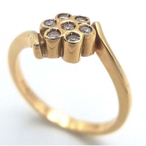 107 - AN 18K YELLOW GOLD DIAMOND TWIST CLUSTER RING. 3.65G IN WEIGHT. SIZE N. Ref: A/S 1194