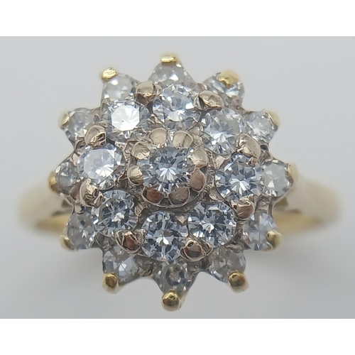 142 - AN 18K YELLOW GOLD DIAMOND CLUSTER RING 0.65CT. 4.7G IN WEIGHT. SIZE L AND 1/2. Ref: SC 1049