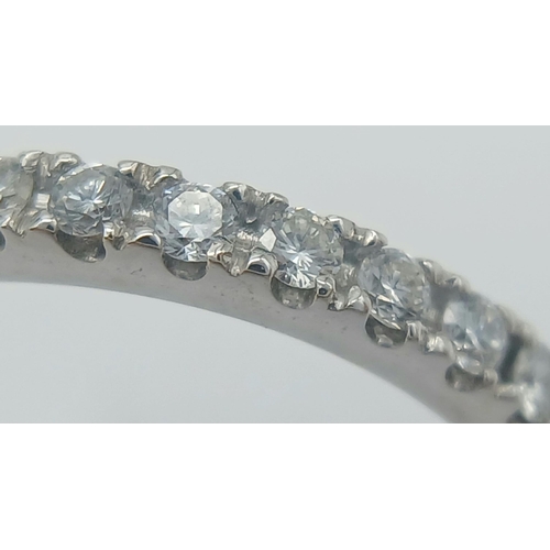 149 - AN 18K WHITE GOLD DIAMOND 1/2 ET RING. 0.35CT. 2.85G IN WEIGHT. SIZE L. Ref: SC 1055