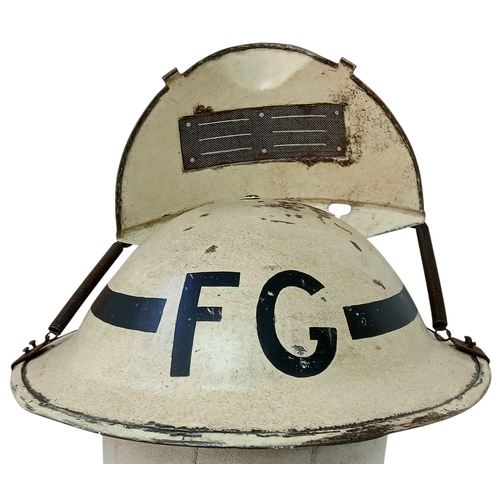 162 - A WW2 British Home Front Fire Guards Helmet with a private purchase “Quick Action” Visor attachment.