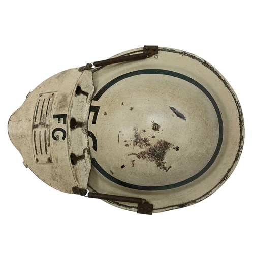 162 - A WW2 British Home Front Fire Guards Helmet with a private purchase “Quick Action” Visor attachment.