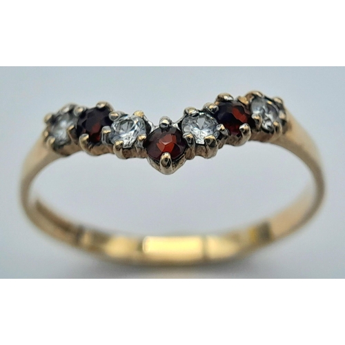 203 - Traditional 9 CARAT GOLD WISHBONE RING. Set with GARNETS and SPARKLING ZIRCONIAS. 1.2 grams. Size O ... 