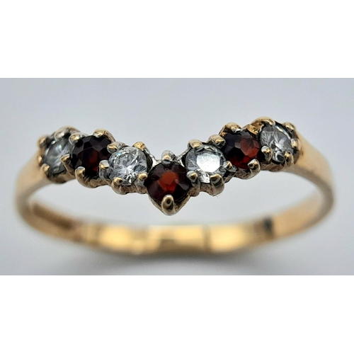 203 - Traditional 9 CARAT GOLD WISHBONE RING. Set with GARNETS and SPARKLING ZIRCONIAS. 1.2 grams. Size O ... 