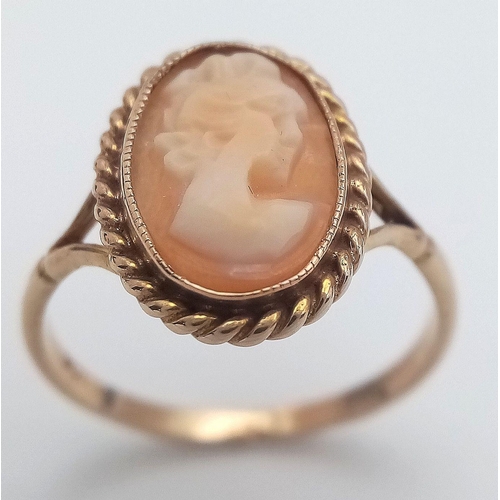 245 - Classic 9 CARAT GOLD CAMEO RING. Oval shape with beautiful GOLD ROPE surround. 2.06 grams. Size N.