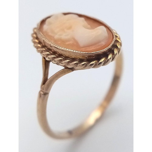 245 - Classic 9 CARAT GOLD CAMEO RING. Oval shape with beautiful GOLD ROPE surround. 2.06 grams. Size N.