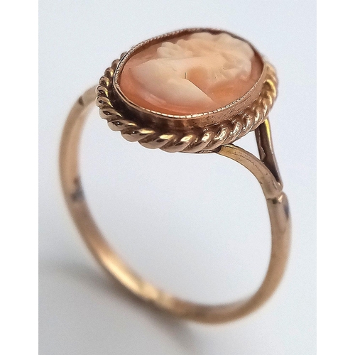 245 - Classic 9 CARAT GOLD CAMEO RING. Oval shape with beautiful GOLD ROPE surround. 2.06 grams. Size N.