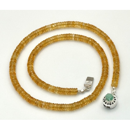 249 - An 85ct AAA quality citrine gemstone necklace featuring faceted citrine beads and an emerald-accente... 