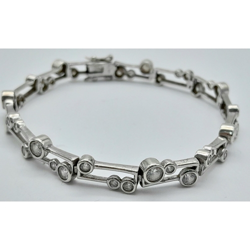 287 - Beautiful SILVER TENNIS BRACELET tramline set with Round Cut ZIRCONIA GEMSTONES.19 cm.