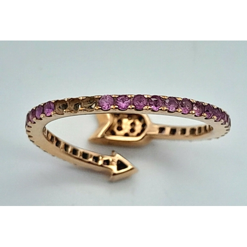 296 - AN 18K ROSE GOLD DIAMOND & RUBY ARROW DESIGN RING. 2.2G IN WEIGHT. SIZE L. Ref: SC 1069