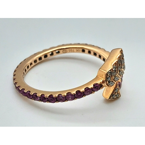 296 - AN 18K ROSE GOLD DIAMOND & RUBY ARROW DESIGN RING. 2.2G IN WEIGHT. SIZE L. Ref: SC 1069