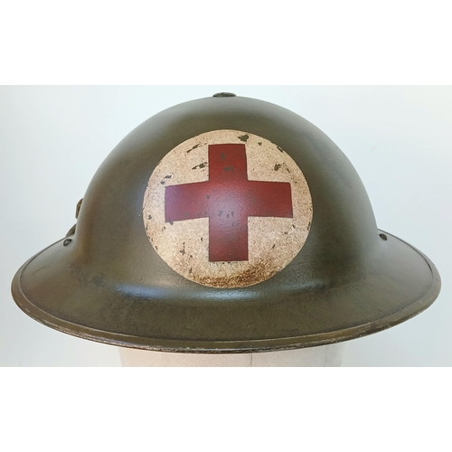 325 - An Early War British Mk II Medics Helmet. 1939 Dated. Maker Marked: WD = William Dodson & Sons of Bi... 