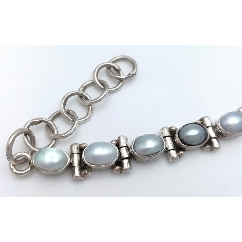 459 - A Vintage Sterling Silver Pearl Set Tennis Bracelet-Fits 18-21cm length. 7mm Width. Gross Weight 14.... 