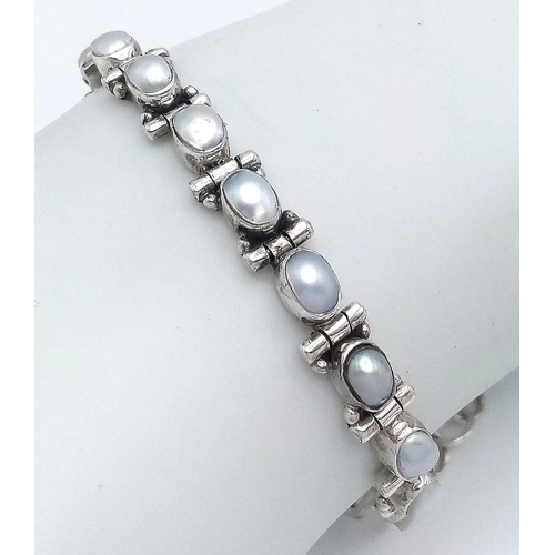 459 - A Vintage Sterling Silver Pearl Set Tennis Bracelet-Fits 18-21cm length. 7mm Width. Gross Weight 14.... 