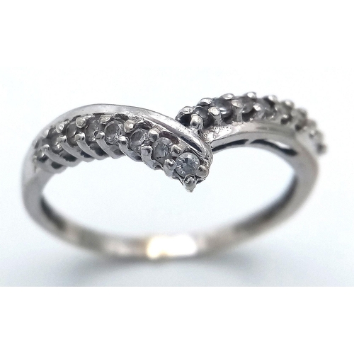 487 - A Parcel of Two Ladies Dress Rings Comprising 1) A 9 Carat White Gold Cubic Zirconia Wishbone Design... 