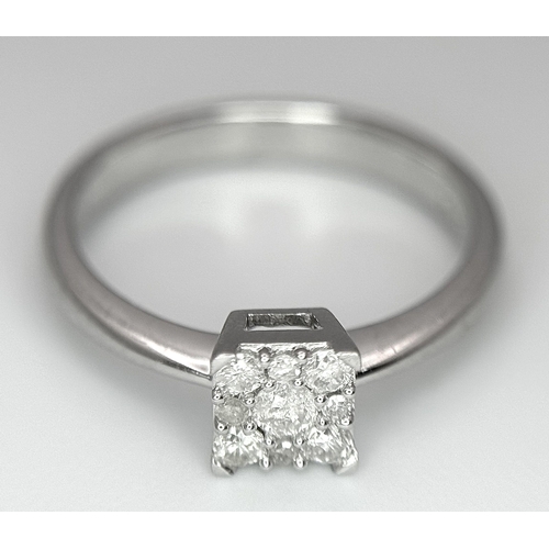 506 - A 9K WHITE GOLD DIAMOND RING 0.15CT. 1.9G IN WEIGHT. SIZE H. Ref: SC 1009