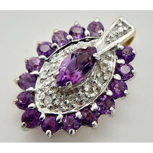 527 - A 9K YELLOW GOLD DIAMOND & AMETHYST PENDANT. 1.7G IN WEIGHT. APPROX. 1.8CM IN HEIGHT AND 1.1CM IN WI... 