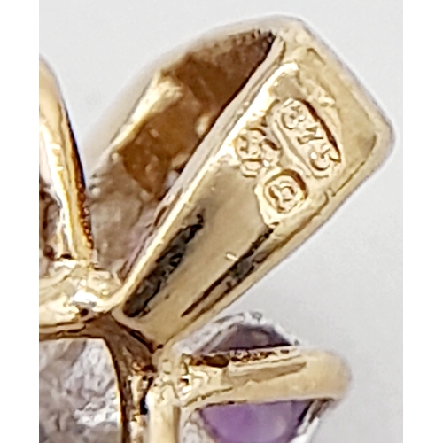 527 - A 9K YELLOW GOLD DIAMOND & AMETHYST PENDANT. 1.7G IN WEIGHT. APPROX. 1.8CM IN HEIGHT AND 1.1CM IN WI... 