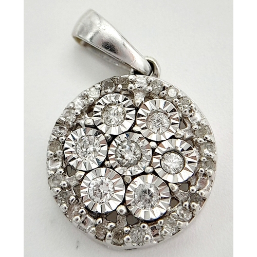 548 - A 9K WHITE GOLD DIAMOND SET PENDANT 1.65G IN WEIGHT. APPROX. 1.2CM IN DIAMETER. Ref: SC 1022