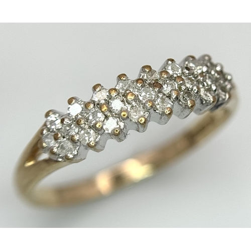 583 - A 9K YELLOW GOLD DIAMOND 3 ROW BAND RING. 1.65G TOTAL WEIGHT. SIZE L AND 1/2. Ref: SC 1036