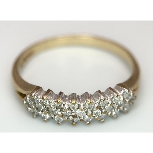 583 - A 9K YELLOW GOLD DIAMOND 3 ROW BAND RING. 1.65G TOTAL WEIGHT. SIZE L AND 1/2. Ref: SC 1036