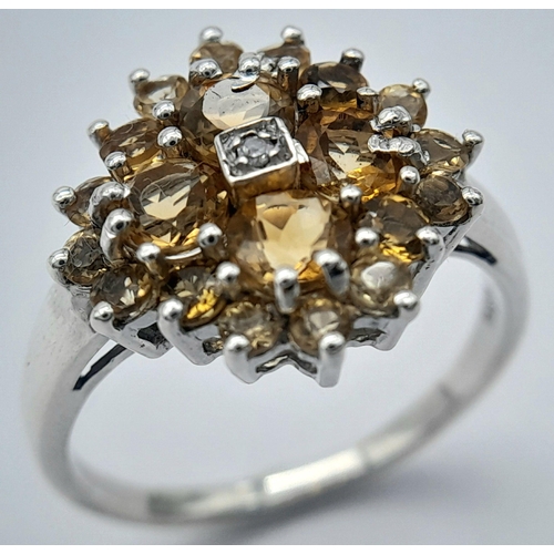 676 - An Elegant Sterling Silver Citrine and Diamond Ring Size O. The Crown measures 1.5cm Diameter and th... 