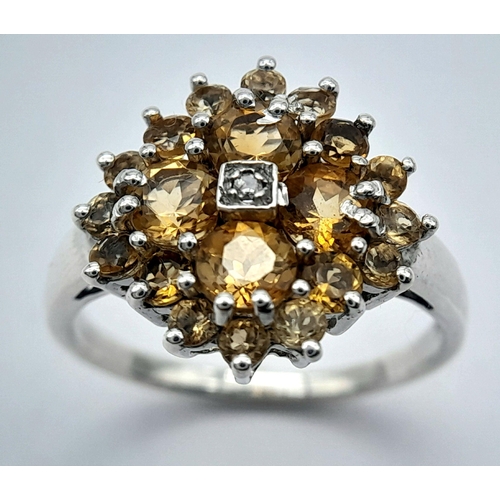 676 - An Elegant Sterling Silver Citrine and Diamond Ring Size O. The Crown measures 1.5cm Diameter and th... 