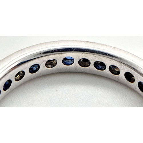 79 - AN 18K WHITE GOLD DIAMOND & SAPPHIRE FULL ETERNITY RING 0.30CT. 3G TOTAL WEIGHT. SIZE J. Ref: TAN 10... 